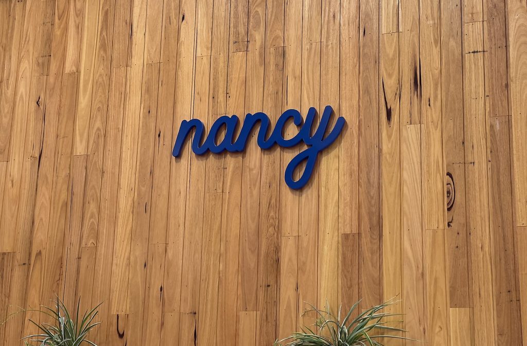 Nancy cafe sign on wooden wall