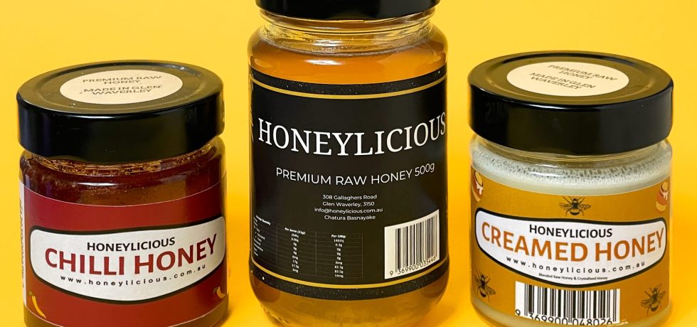 3 jars of Honeylicious honey on a yellow background