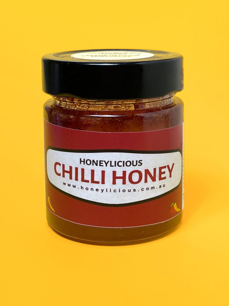 Honeylicious chilli honey on yellow background