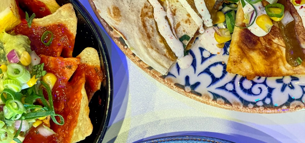 flatlay of mexican food from Hecho en Meixco on blue plates
