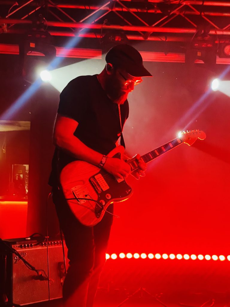 Ishmael Ensemble at Night Cat Fitzroy. Guitarist bathed in red light