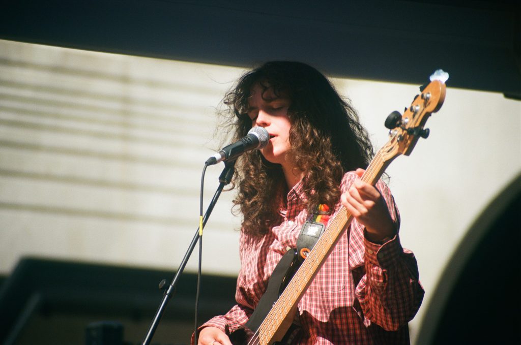 Bassist from Mansplainers playing at St Kilda Festival