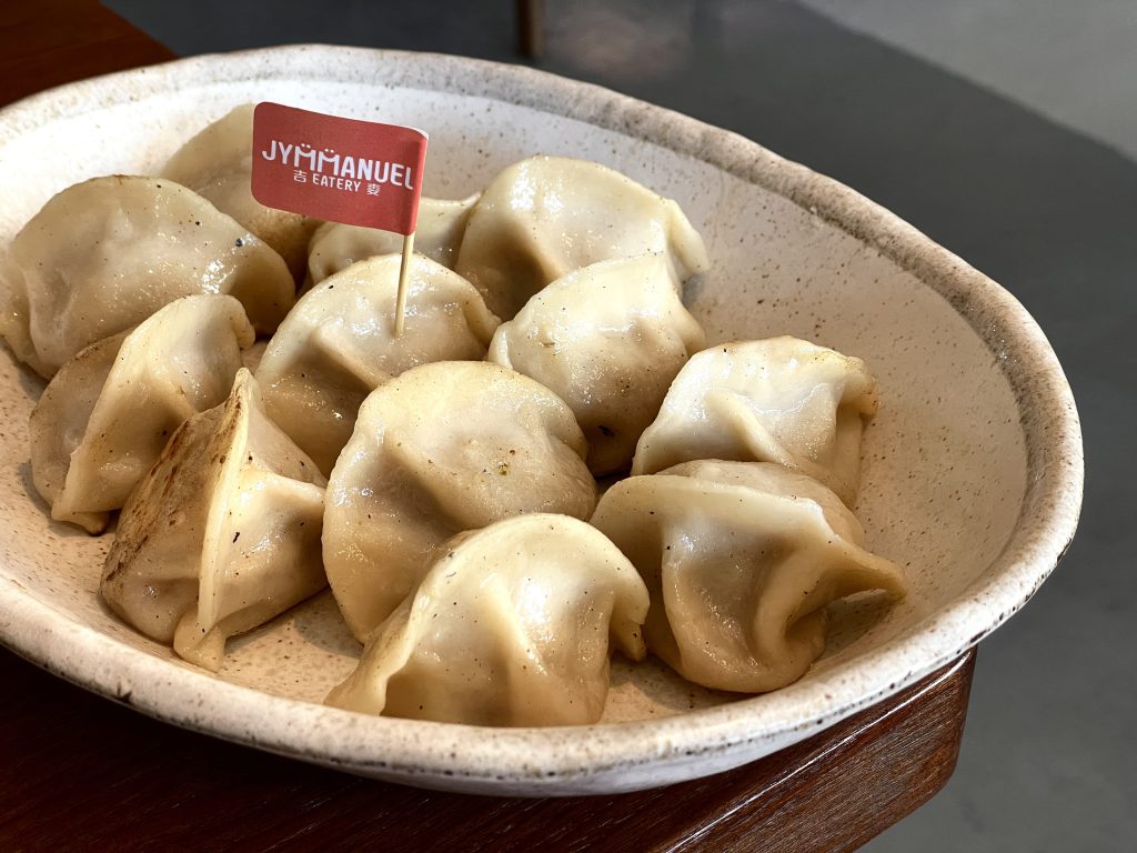 Dumplings in a white bowl from Jymmanuel Eatery