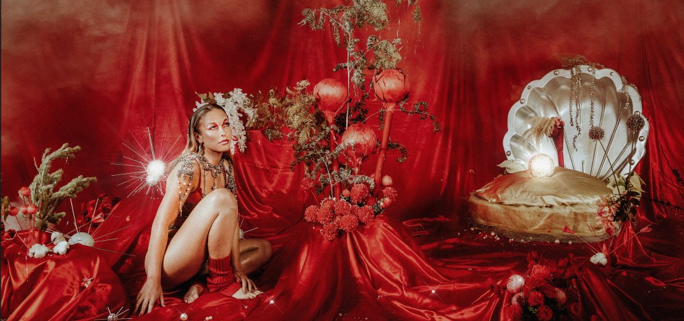 Maddy Herbert of Velvet Bloom with a red background
