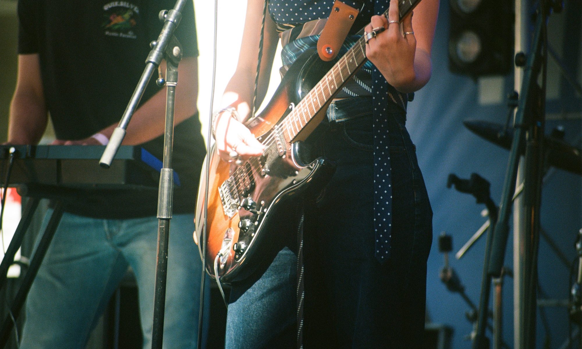 Close up image of woman playing guitar