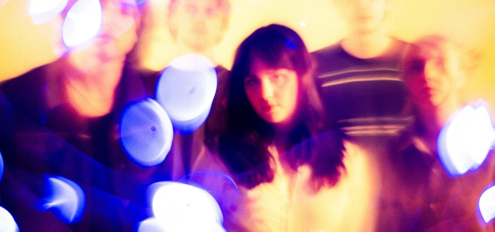 Blurred image of band Vona Vella.