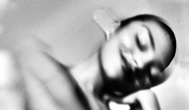 Black and white image of Olivia Dean with motion blur. Cover of The Art of Loving You