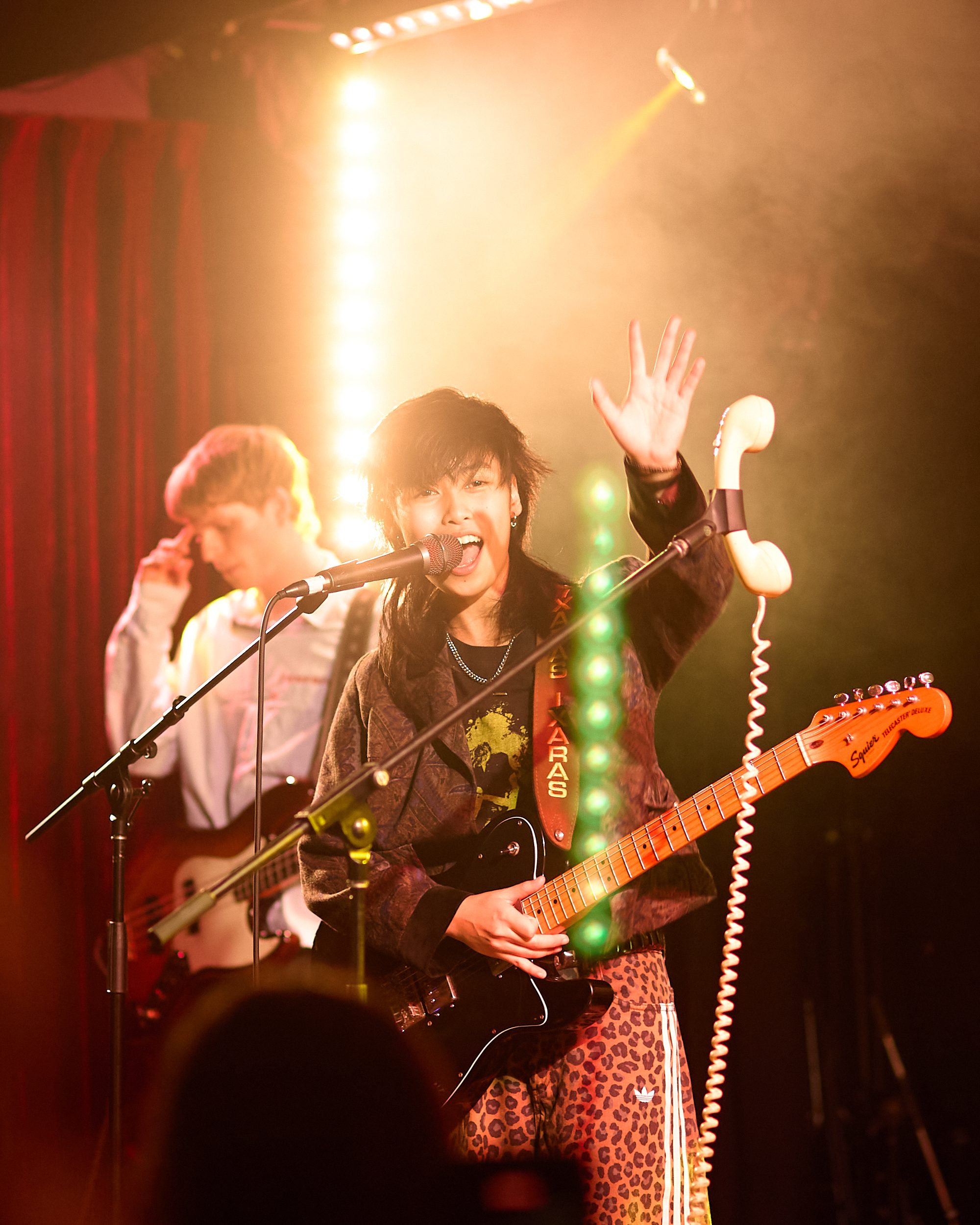 Ixaras waving at the crowd while performing at Melbourne's Leadbeater
