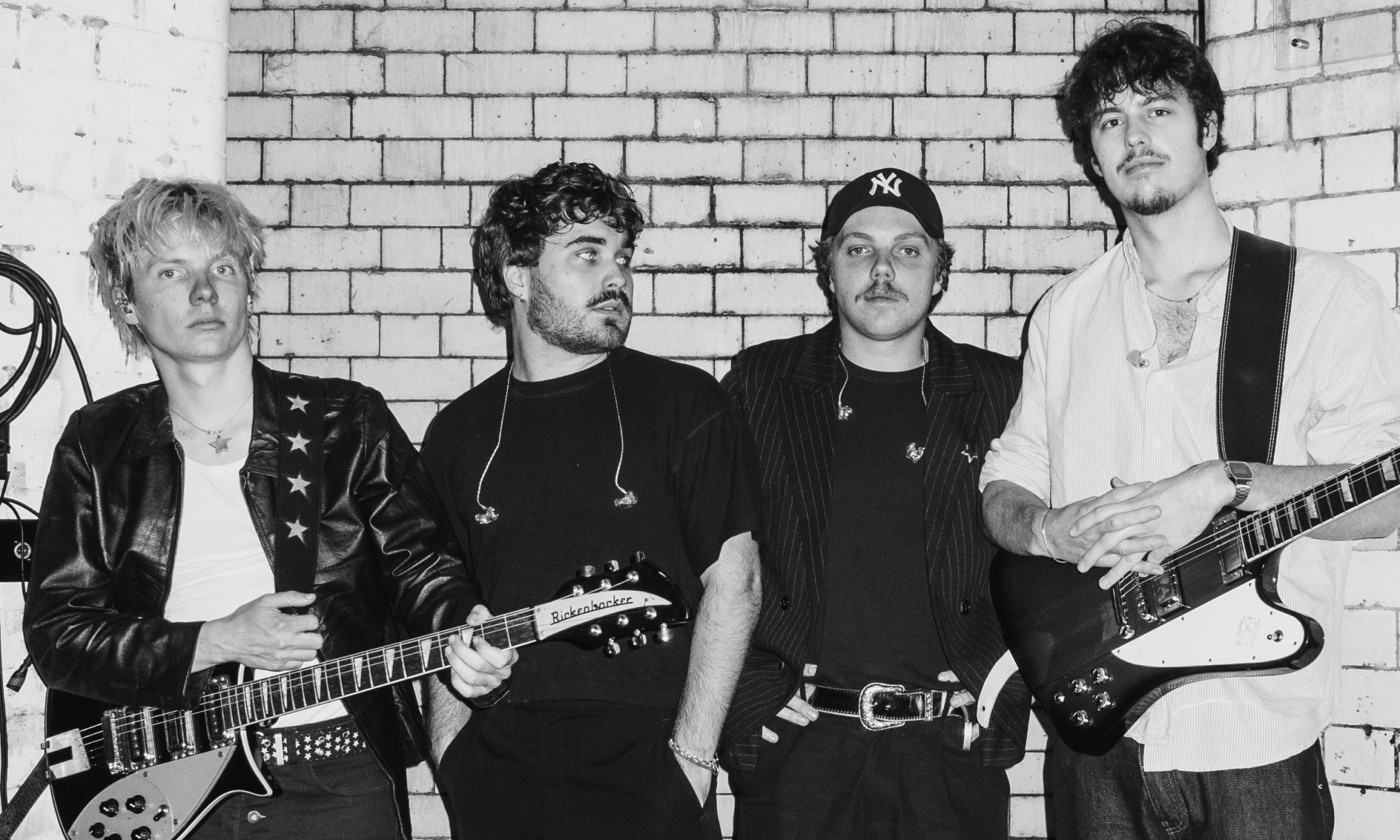 black and white image of the Rions with guitars