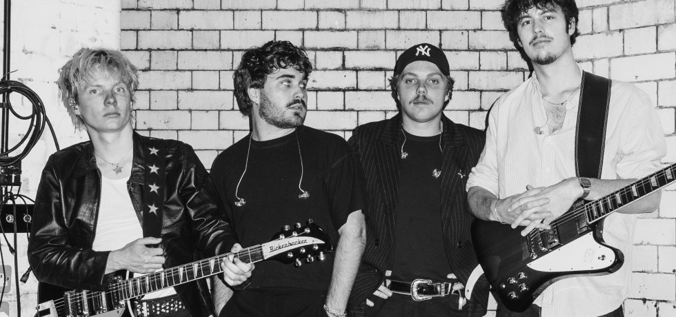 black and white image of the Rions with guitars