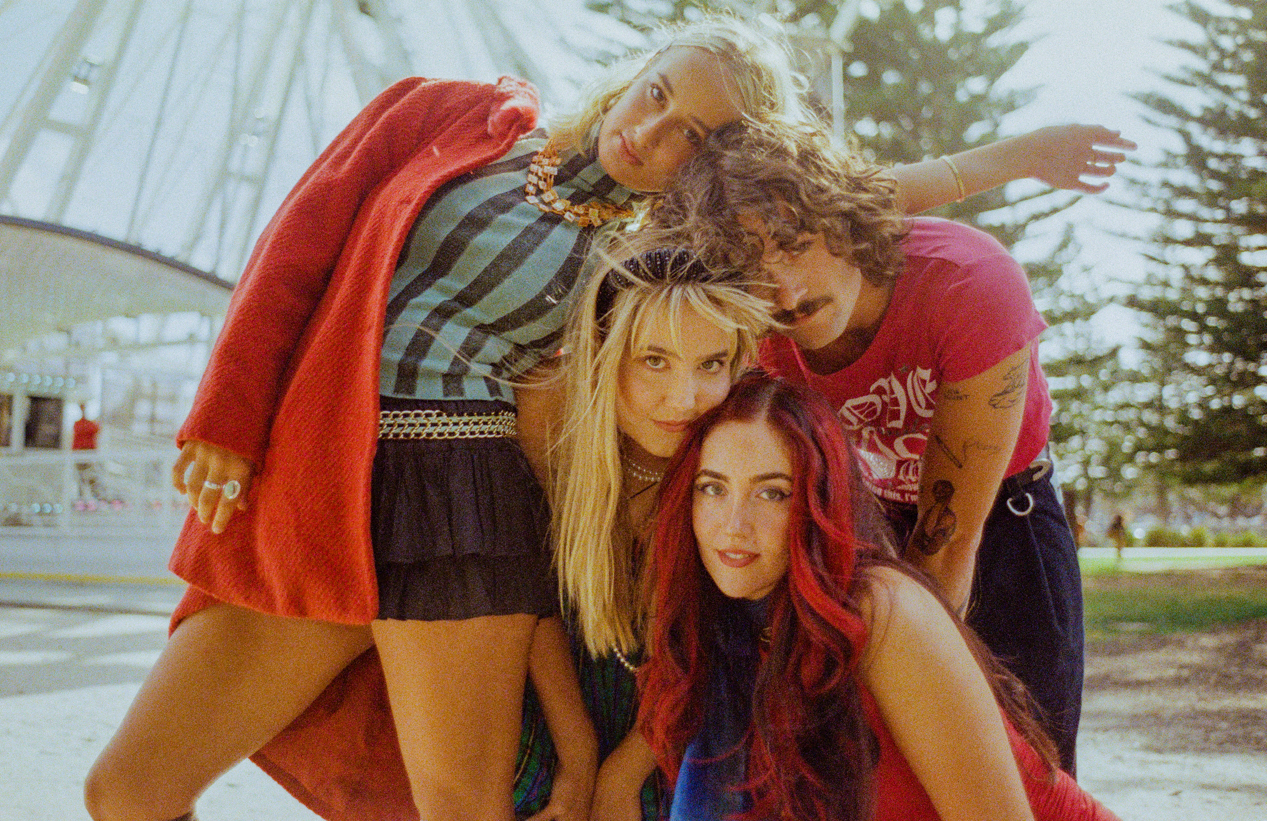 Image of band Blush sharing straight into camera. Promo shot for Embarassed 4 U. 