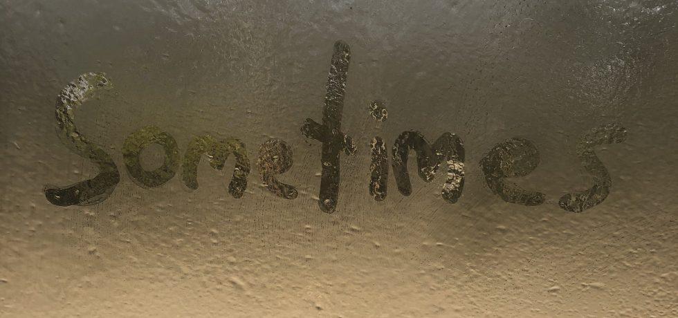 The word sometimes written onto a misted up window. Single Cover for Kirsten Mallyon Sometimes