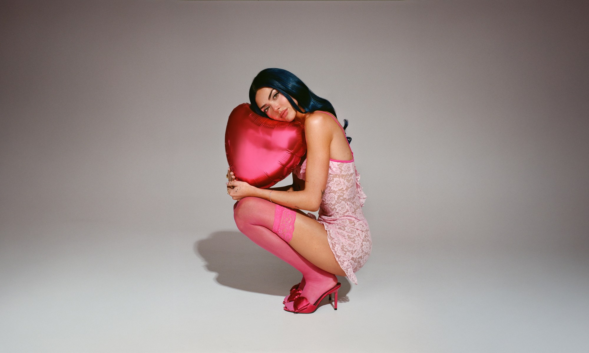 Image of Charley with a heart shaped balloon. Press image for Chronicles of a Serial Idealist.