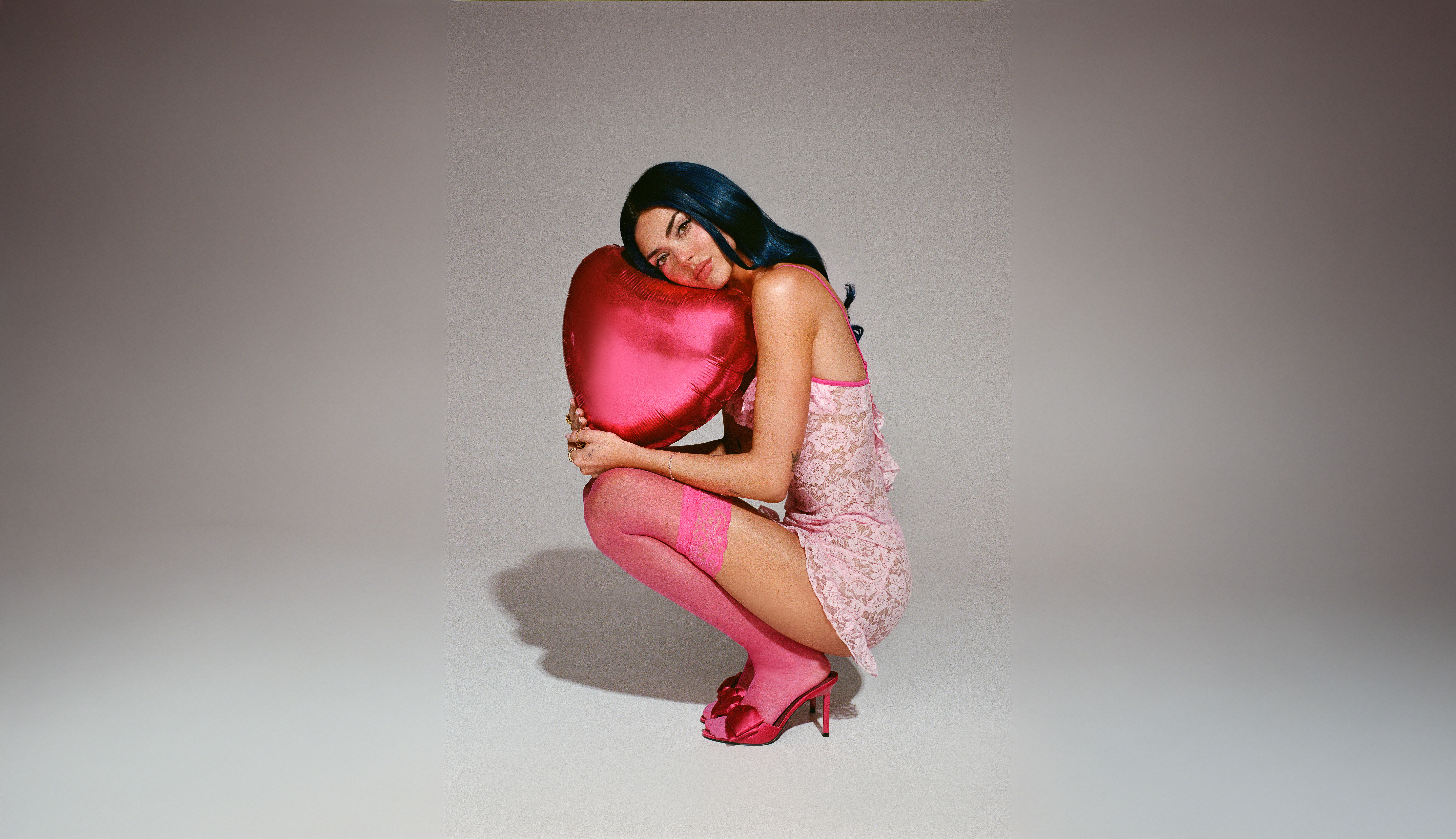 Image of Charley with a heart shaped balloon. Press image for Chronicles of a Serial Idealist.
