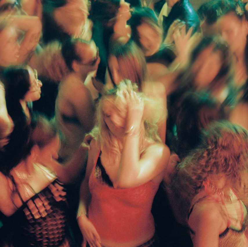 Blurry image of women at a night club. Single cover for EDIE Garden of Edie