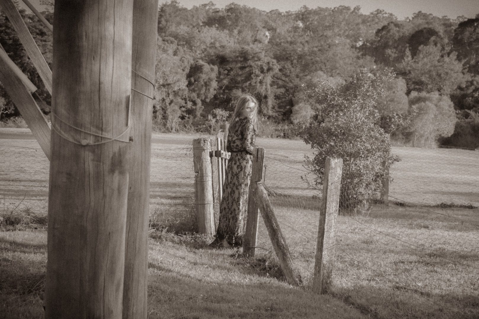 Black and white image of Jean Elliot looking out into a field