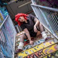 Image of Kaiyah Mercedes on graffiti covered stairs. Single Cover for Miss Me.