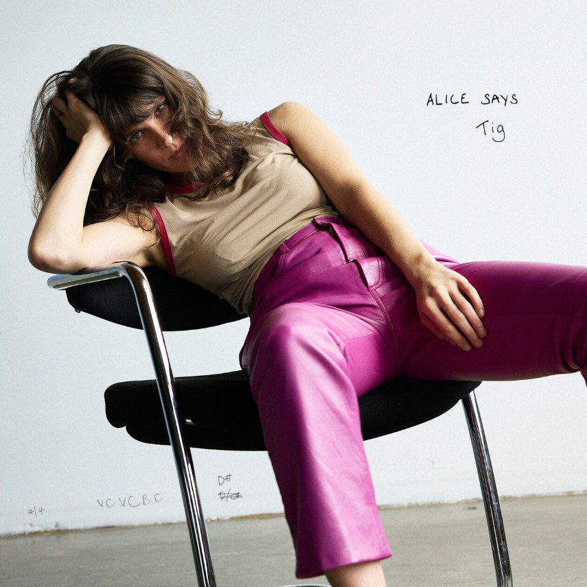 Tig sat slouched on a chair. Single Cover for Alice Says