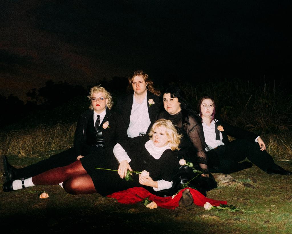 Image of band Worm Girlz taken against a dark background
