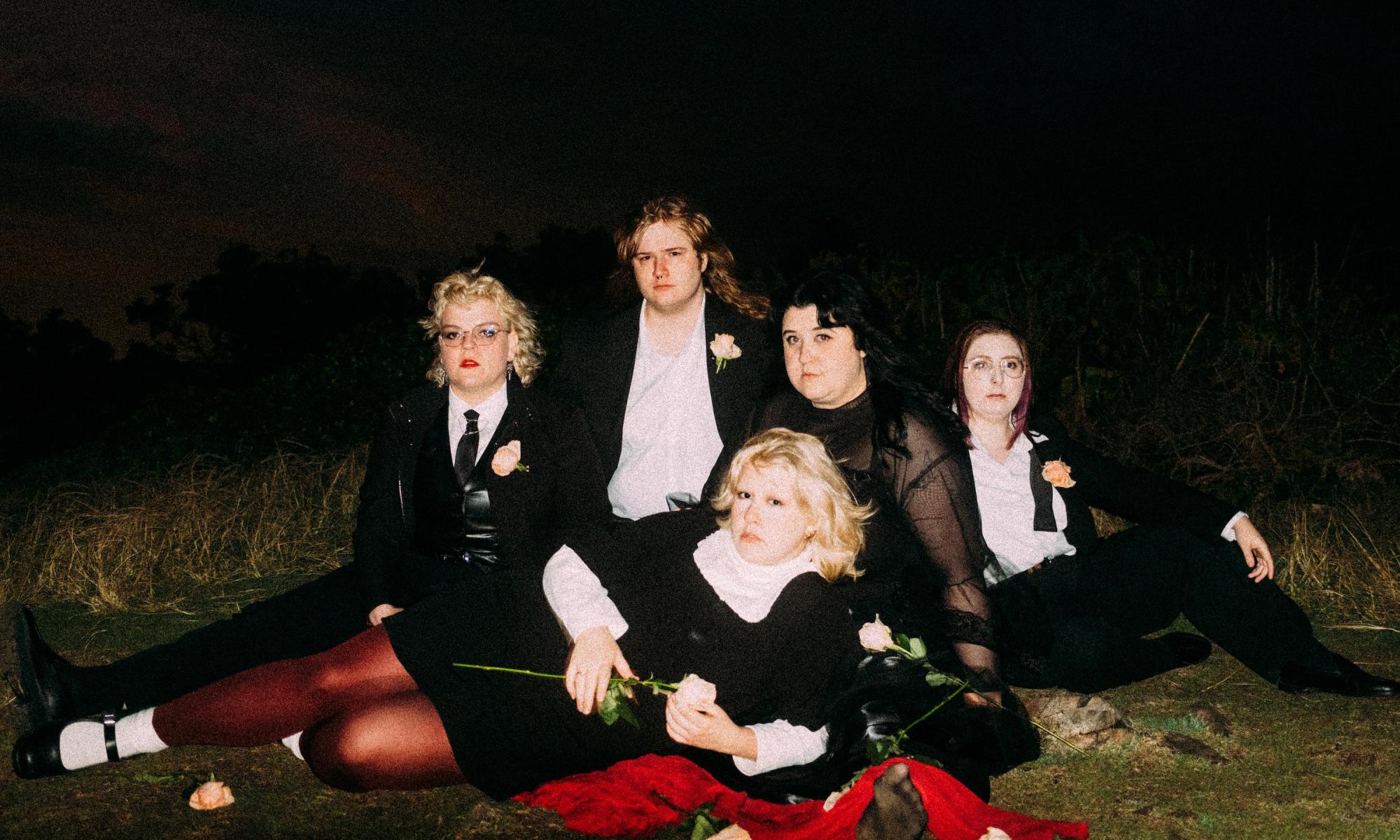 Image of band Worm Girlz taken against a dark background