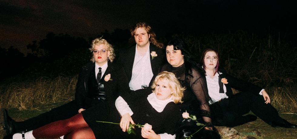 Image of band Worm Girlz taken against a dark background