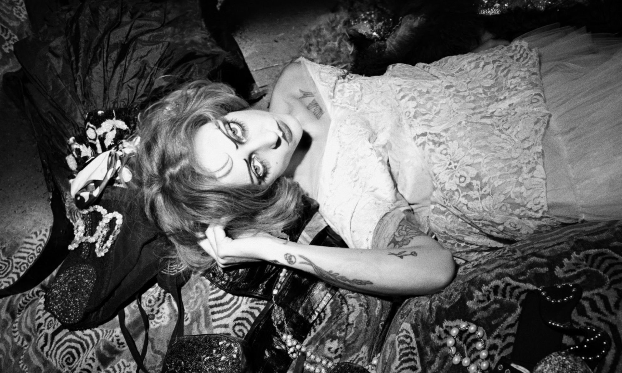 Black and white image of Magdalene with heavy theatrical makeup