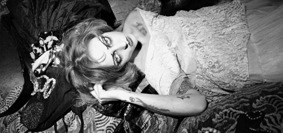 Black and white image of Magdalene with heavy theatrical makeup