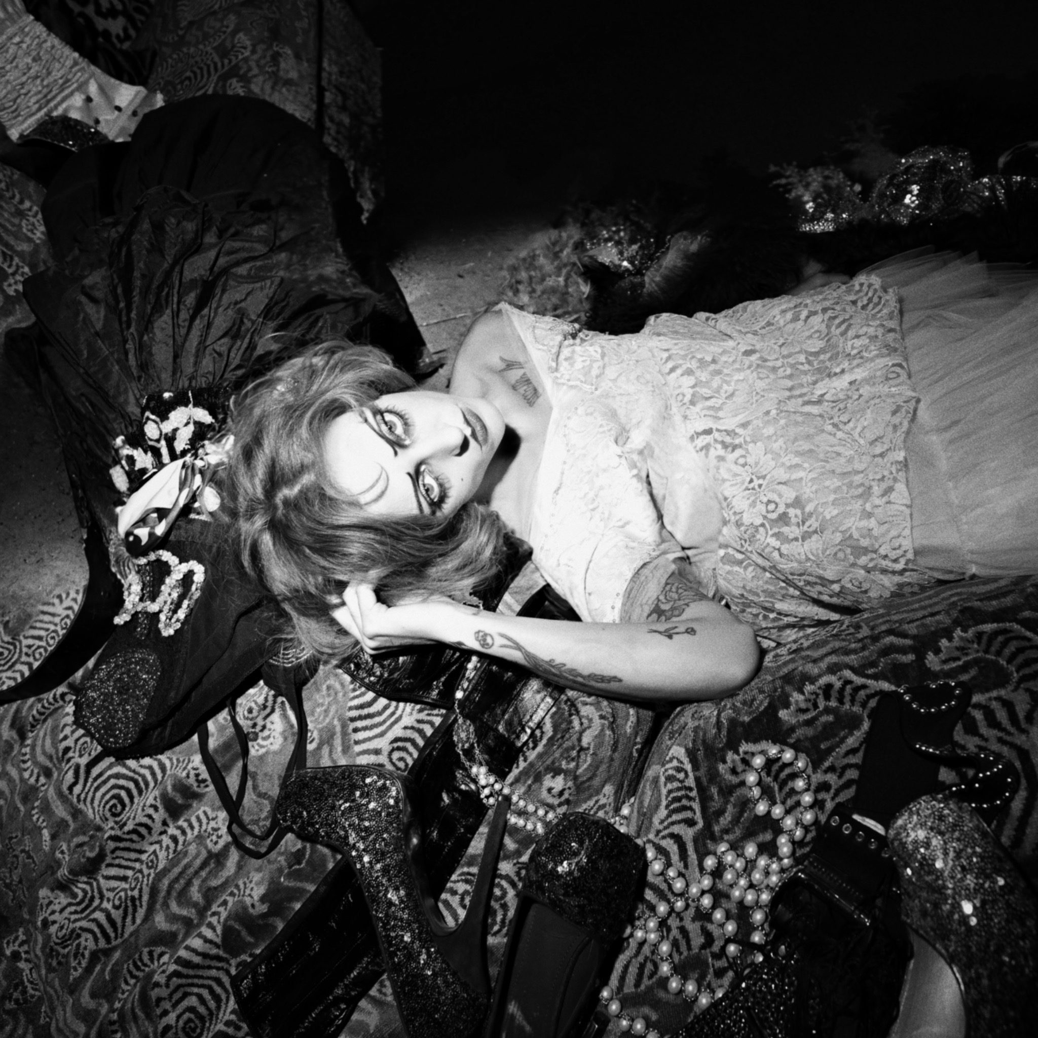 Black and white image of Magdalene with heavy theatrical makeup