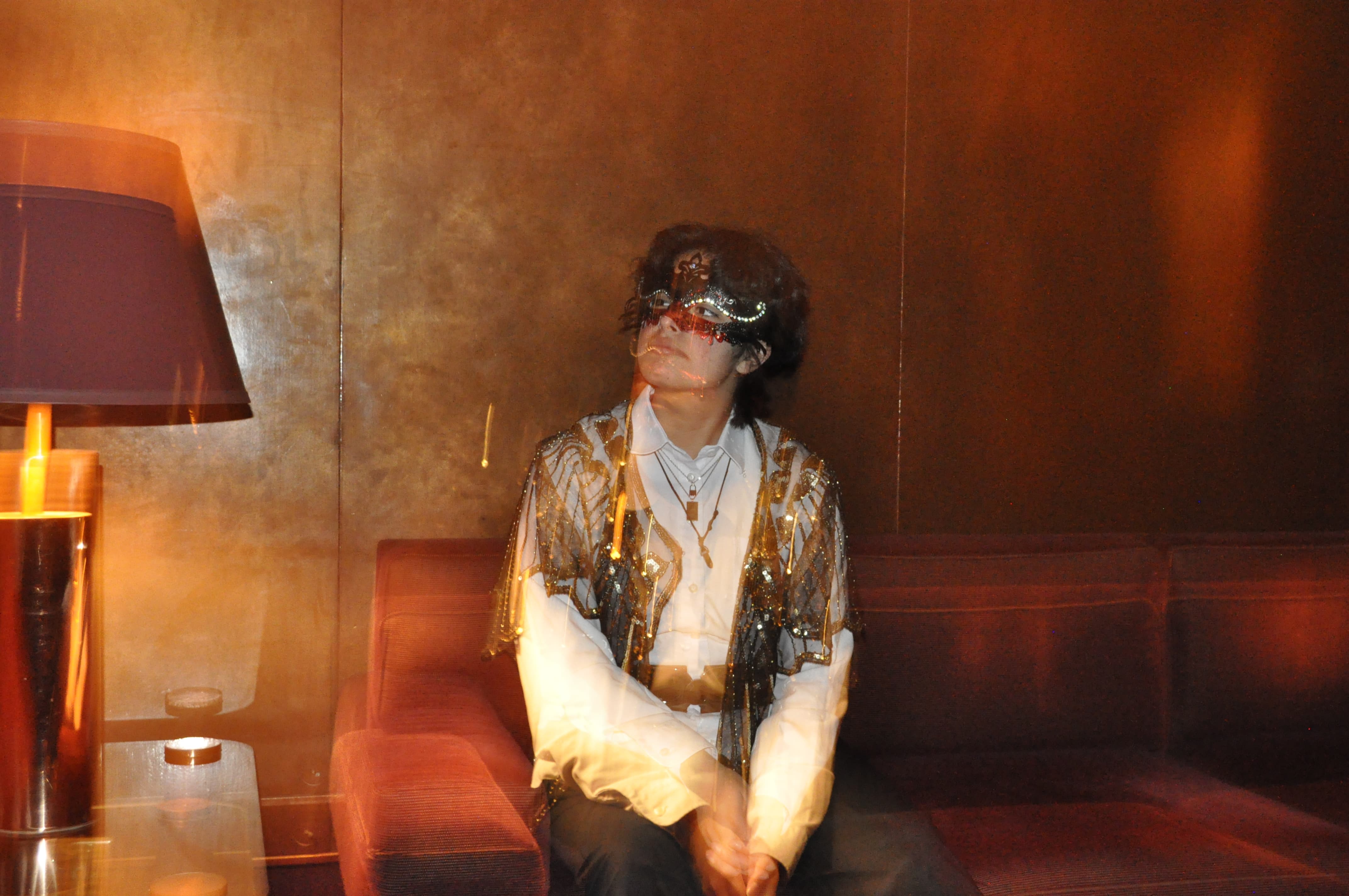 Image of PanKoi seated on a sofa