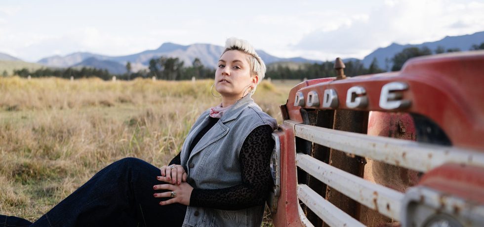 Image of Laura Frank leaning against a truck.
