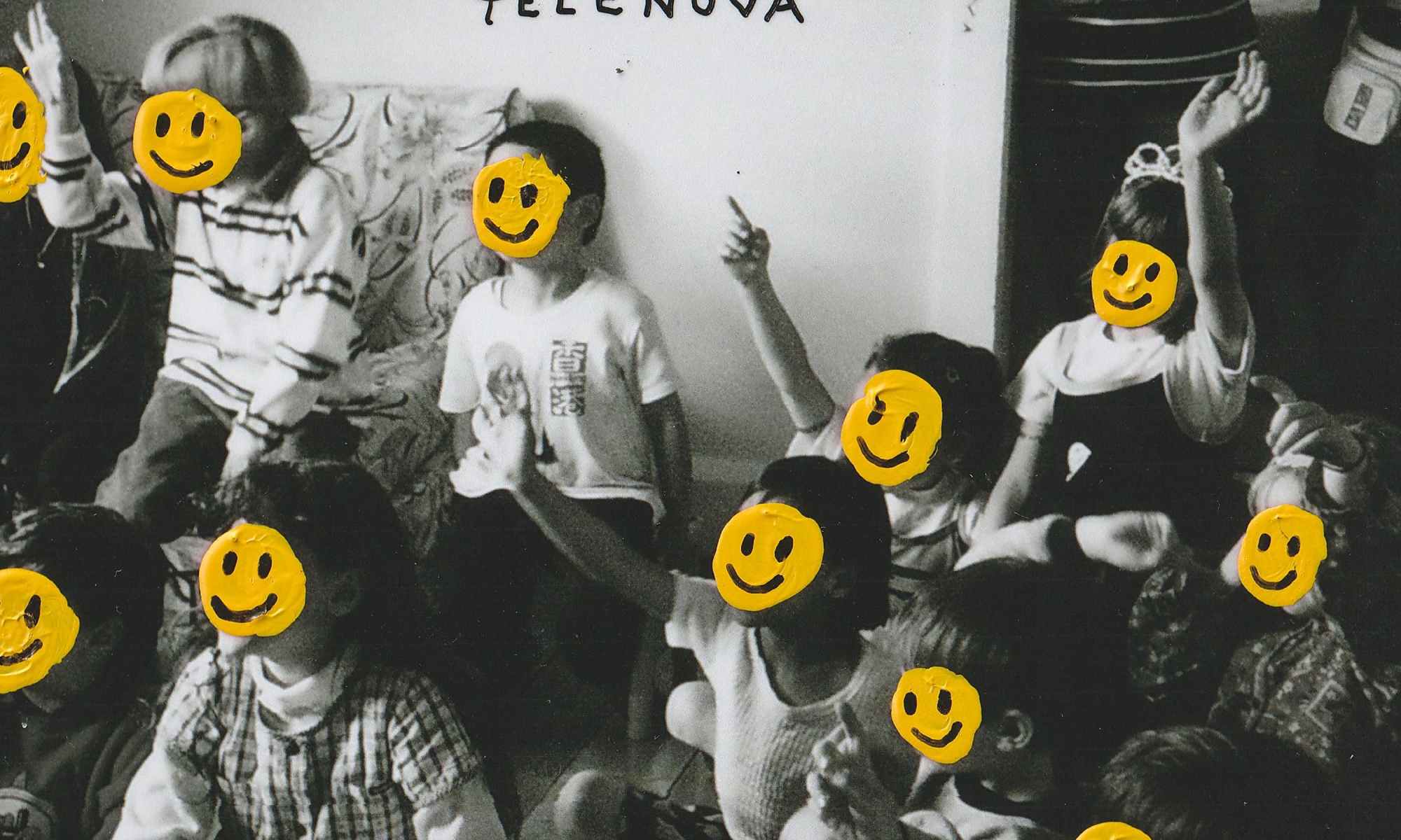 Black and white image of a group of children with their faces covered by yellow smiley faces. Single Cover for Telenova's Happy